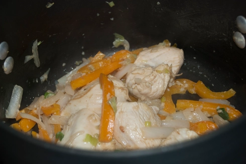 Remove the chicken from the broth and set aside to cool for a bit.