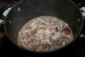 Add the mushrooms and wine